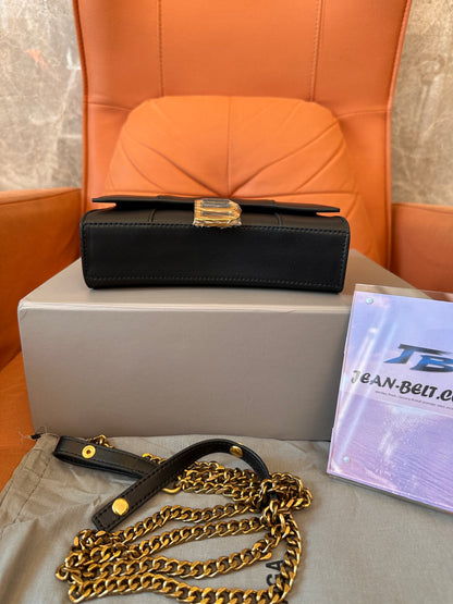 Balenciaga B clutch bag with gold chain strap