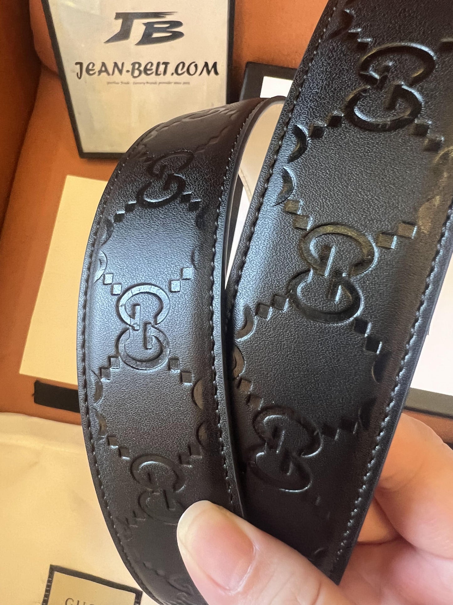 Gucci black embossed leather belt with gold double G buckle