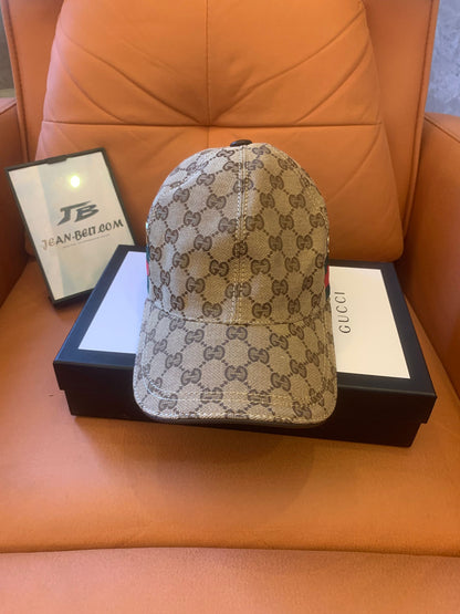 Gucci GG Supreme baseball cap with signature web stripe and metal eyelets