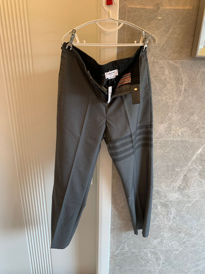 Thom Browne grey wool trousers with signature stripes