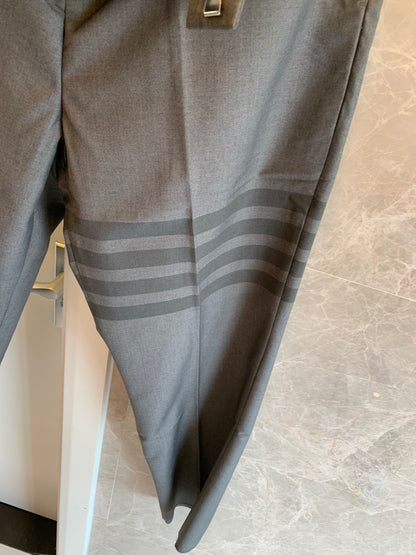 Thom Browne grey wool trousers with signature stripes