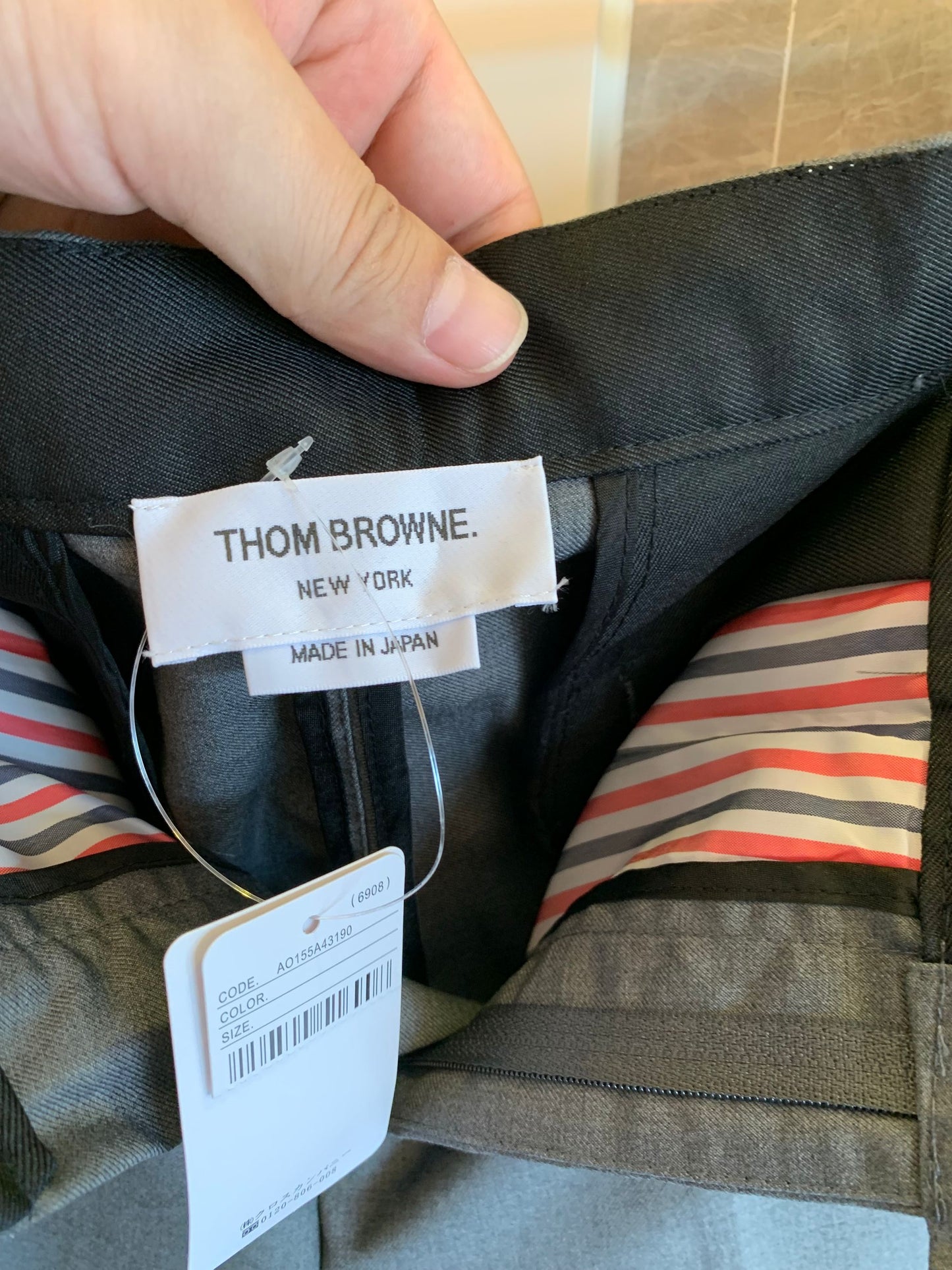 Thom Browne grey wool trousers with signature stripes