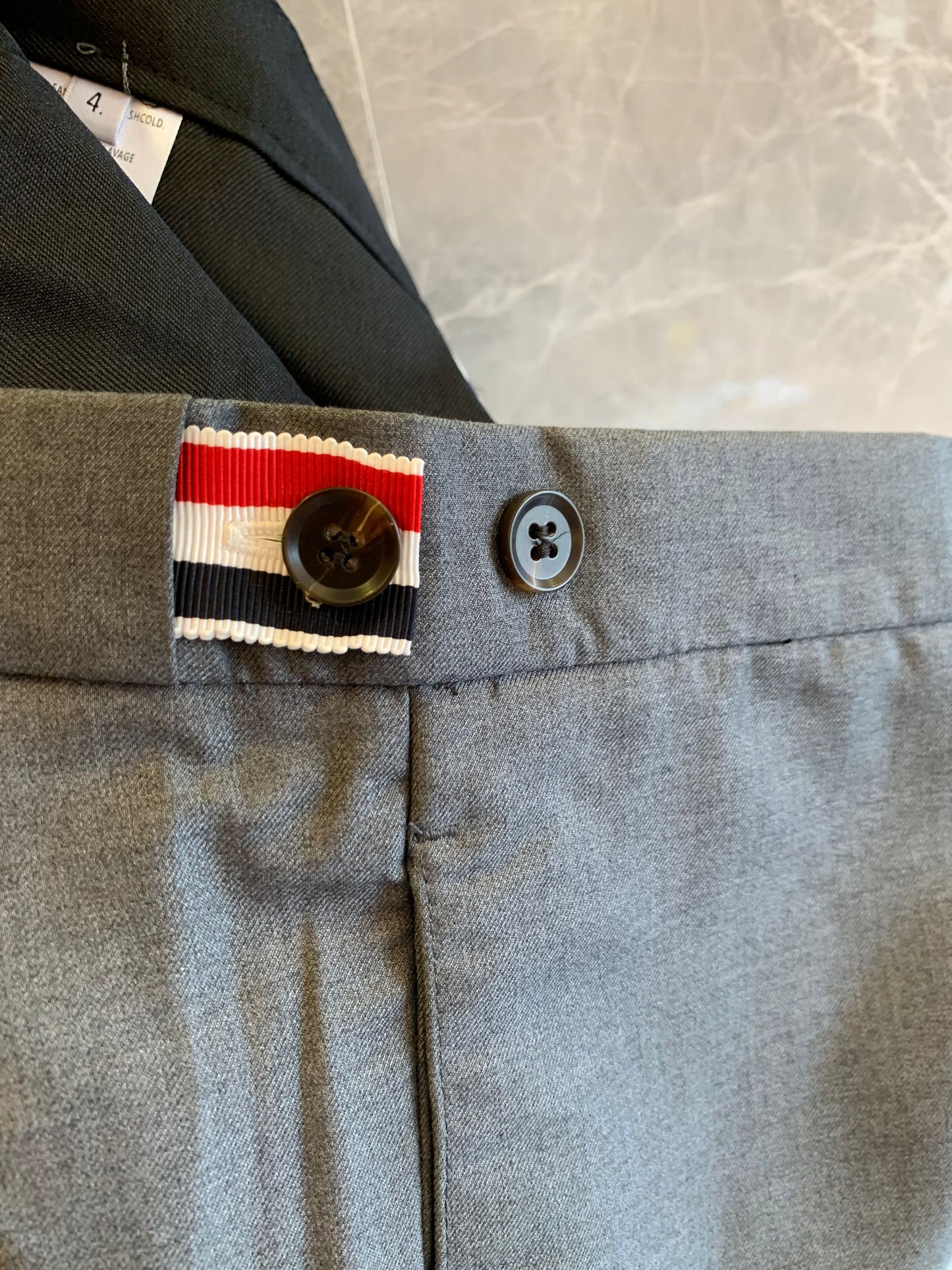 Thom Browne grey wool trousers with signature stripes