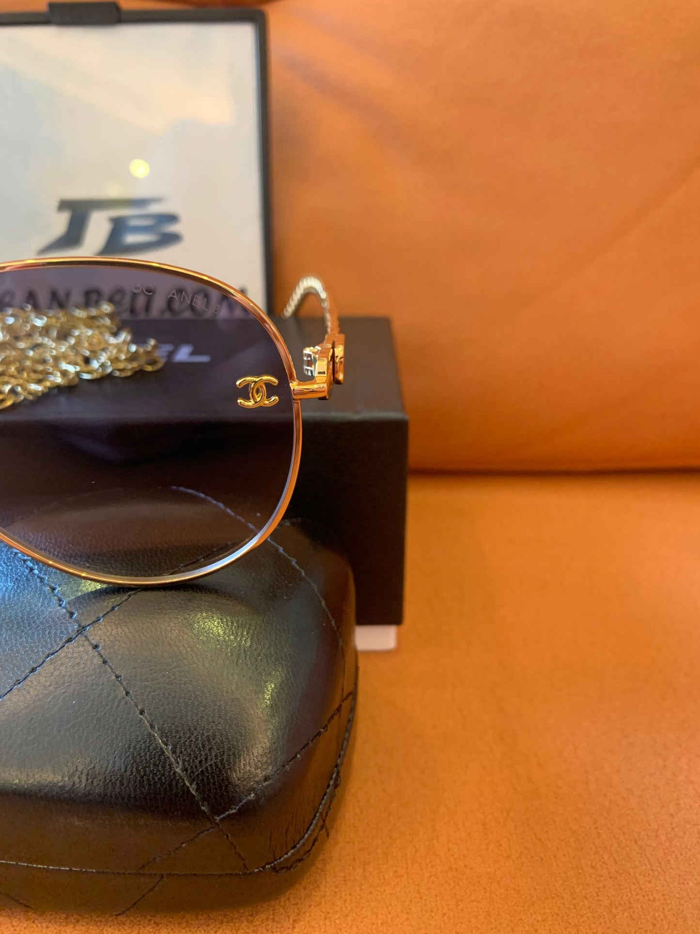 Chanel gold aviator sunglasses with chain accent