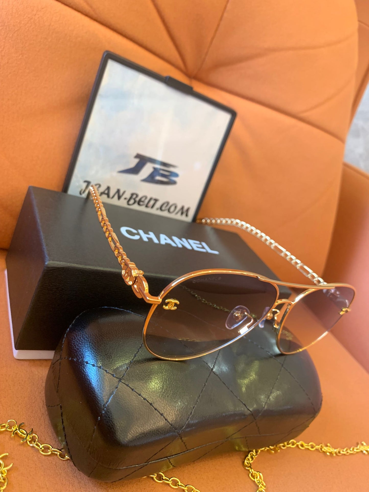 Chanel gold aviator sunglasses with chain accent