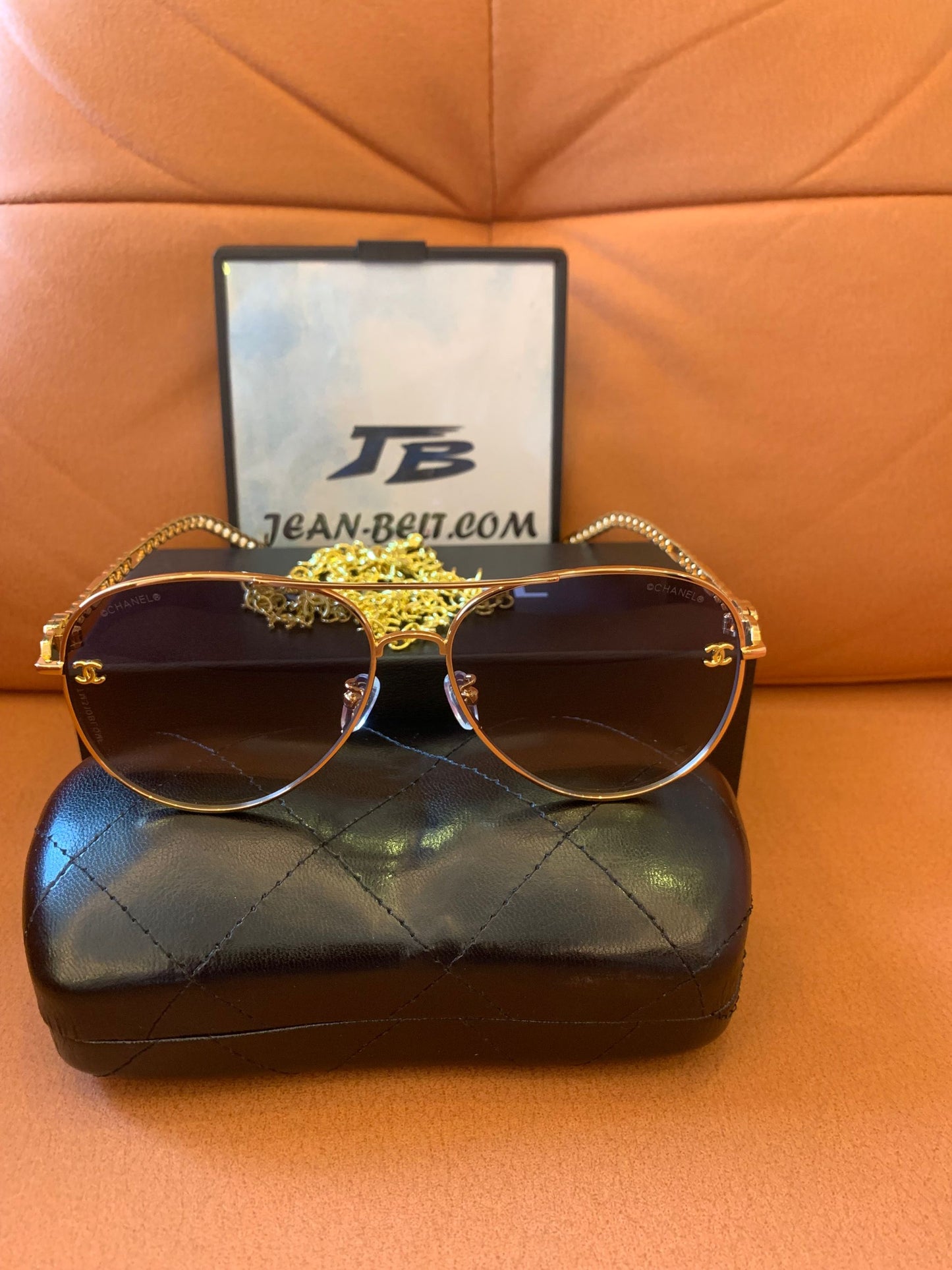 Chanel gold aviator sunglasses with chain accent