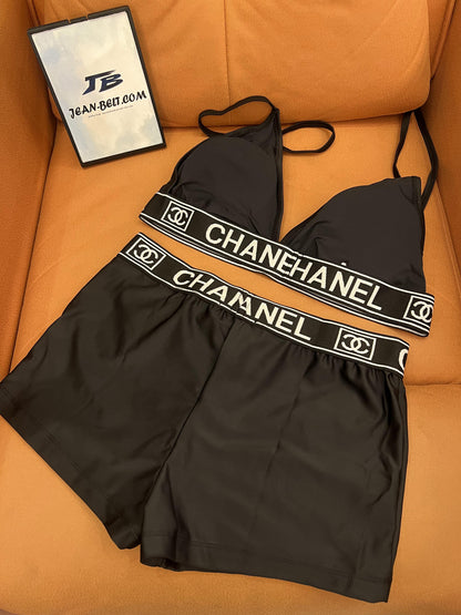 Chanel women's black swim set - triangle top and shorts