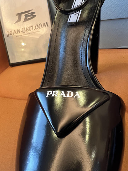 Prada women's black logo triangle platform pumps