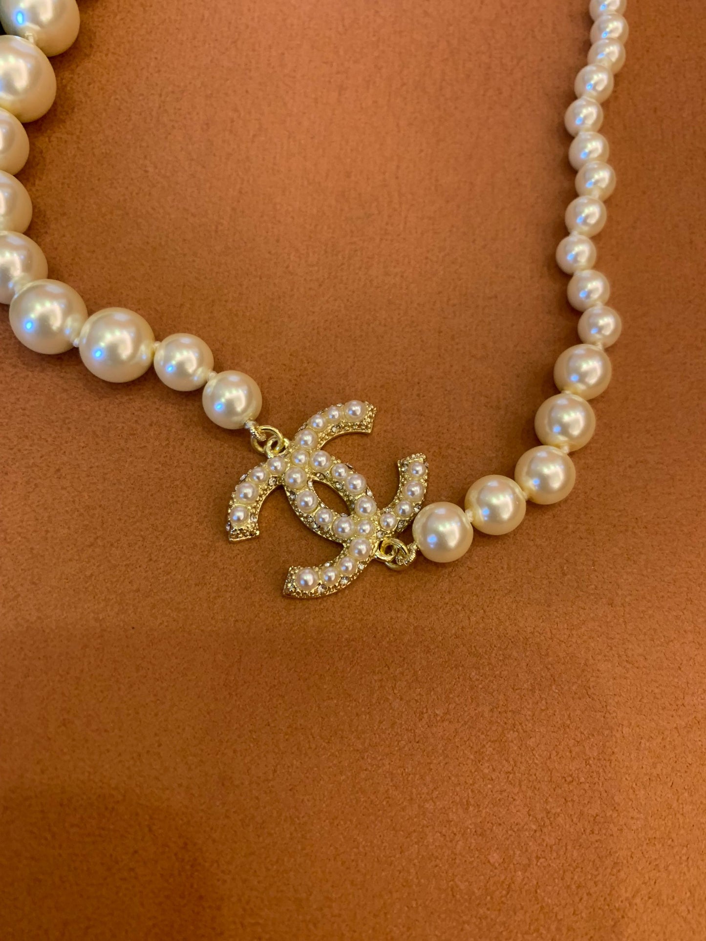 Chanel pearl necklace with signature CC pendant and crystal