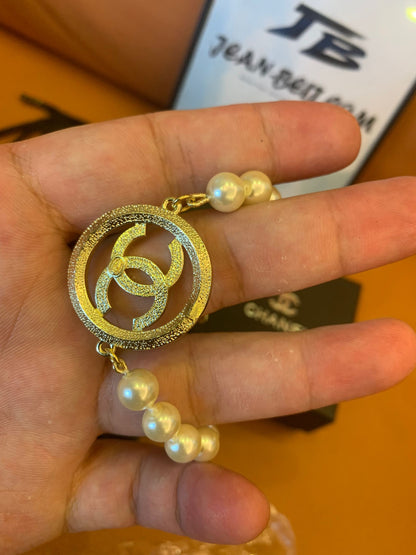 Chanel pearl bracelet with CC crystal pendant