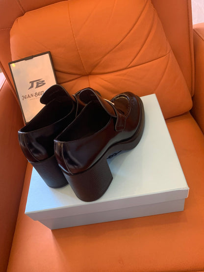 Prada logo-plaque leather heeled loafers