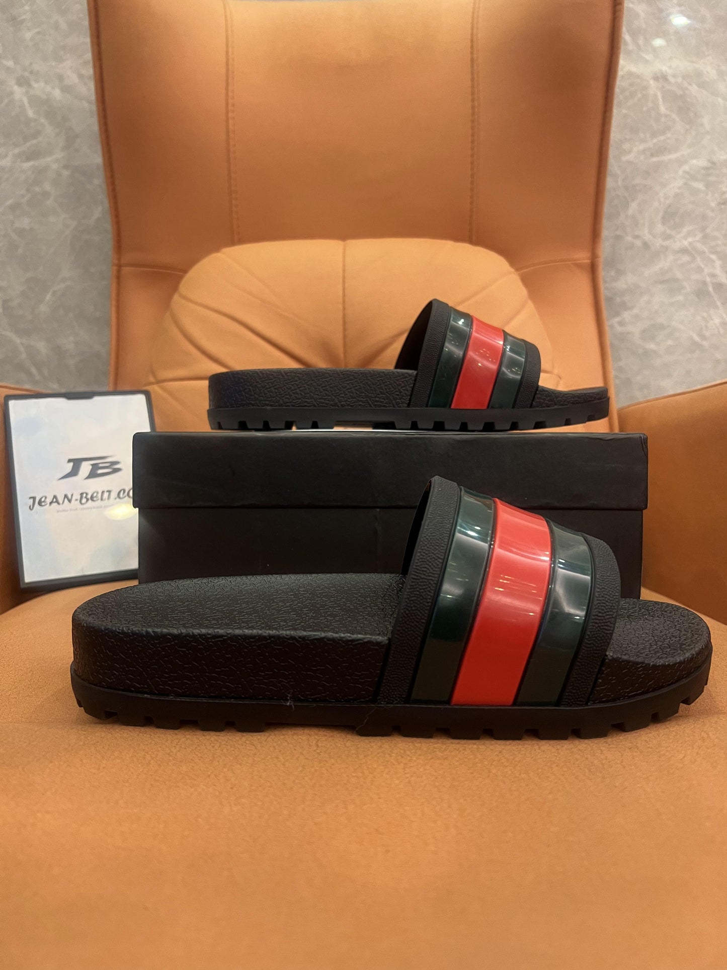 Gucci rubber slide sandals with signature web stripe