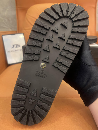 Gucci rubber slide sandals with signature web stripe