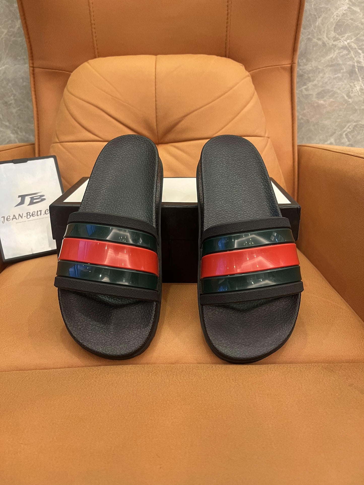 Gucci rubber slide sandals with signature web stripe