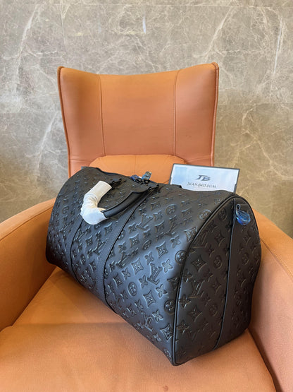 Louis Vuitton black embossed leather travel duffle bag