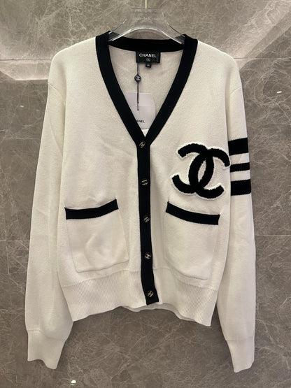 Chanel classic white knit cardigan with black detailing and CC logo