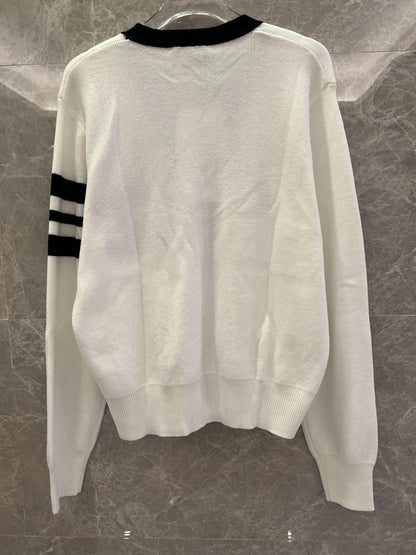 Chanel classic white knit cardigan with black detailing and CC logo