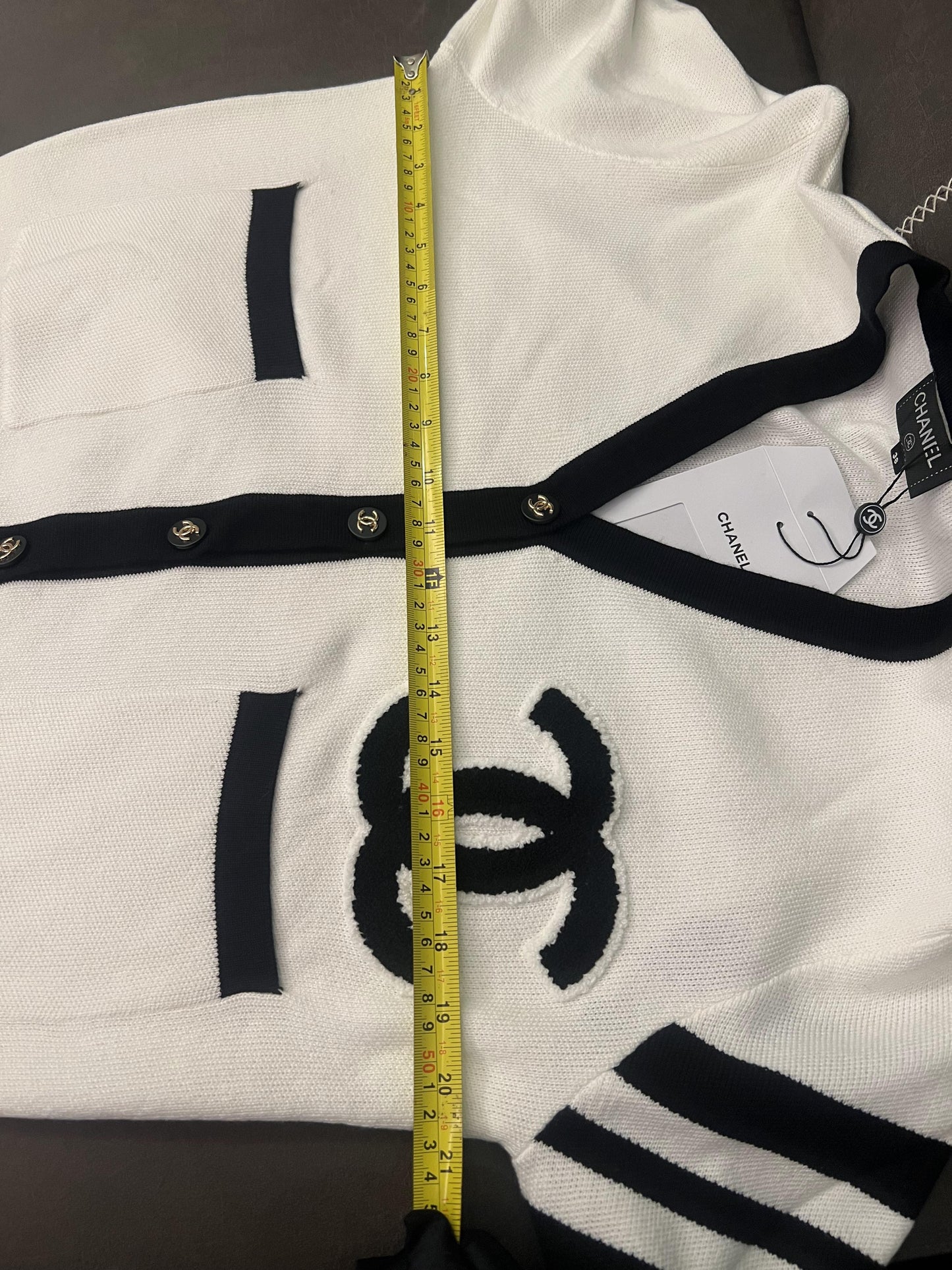 Chanel classic white knit cardigan with black detailing and CC logo