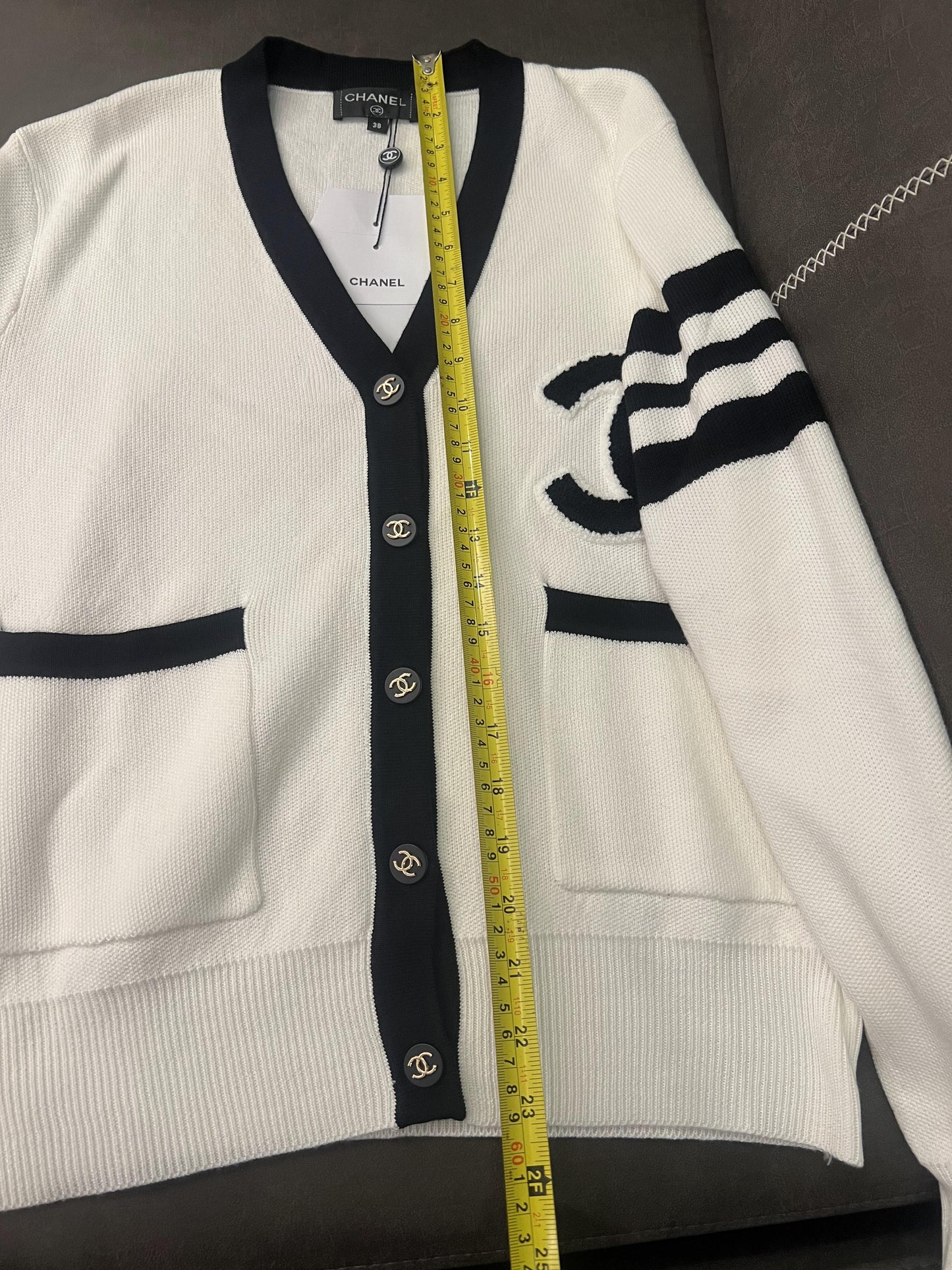 Chanel classic white knit cardigan with black detailing and CC logo