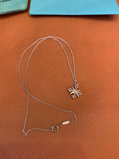 Tiffany & Co. diamond cross pendant necklace