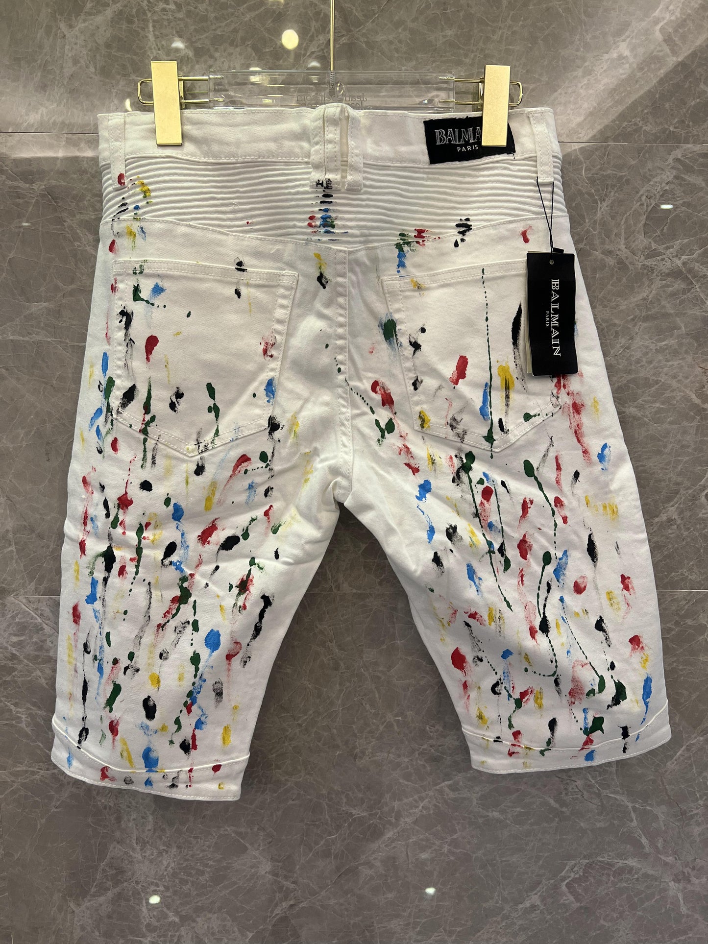 Balmain paint-splattered white denim shorts