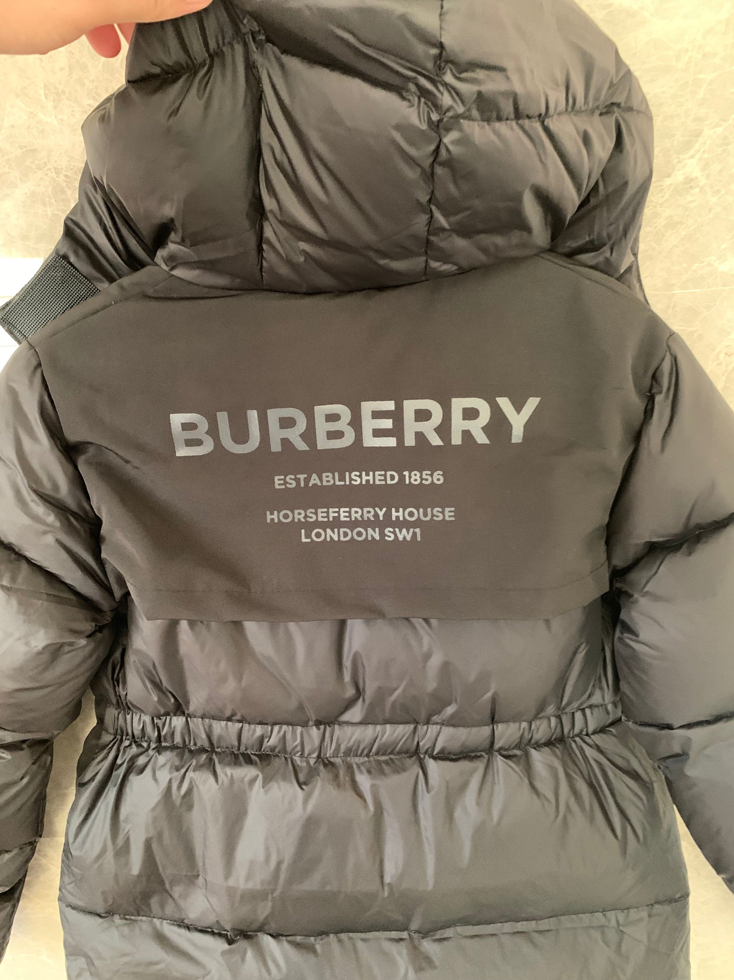 Burberry Kids black puffer jacket with iconic check hood