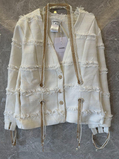 Chanel frayed tweed cardigan with pearl and chain embellishments