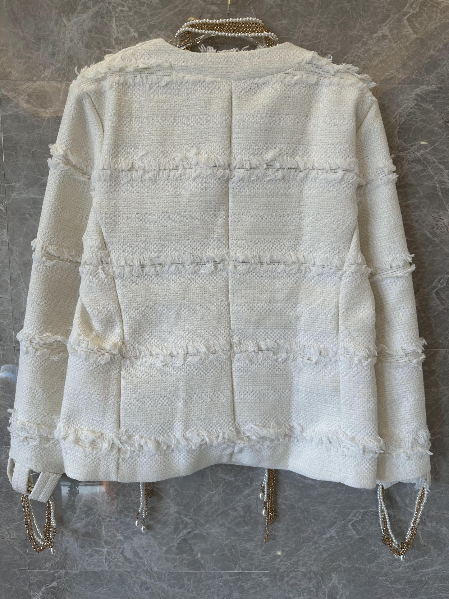 Chanel frayed tweed cardigan with pearl and chain embellishments