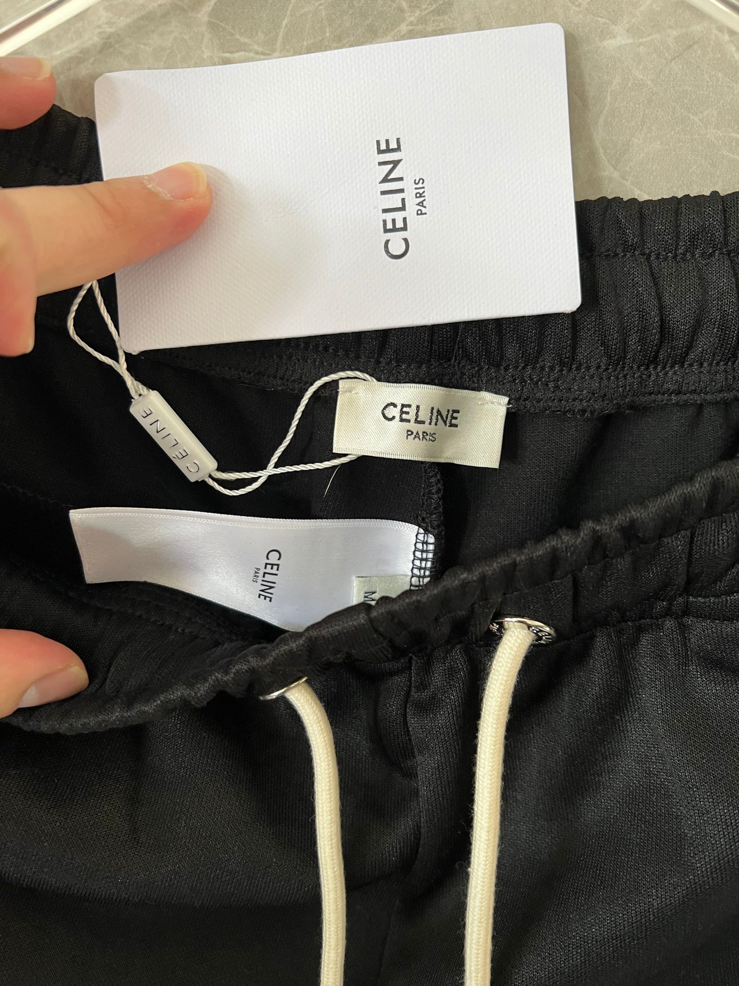 Celine men's black track pants with white side stripes