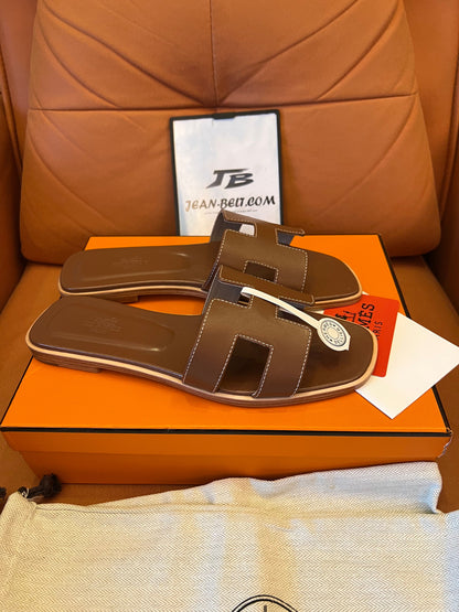 Hermès Oran sandals - brown and green leather slides, classic "H" design