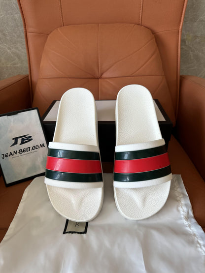 Gucci white rubber slides with web stripe