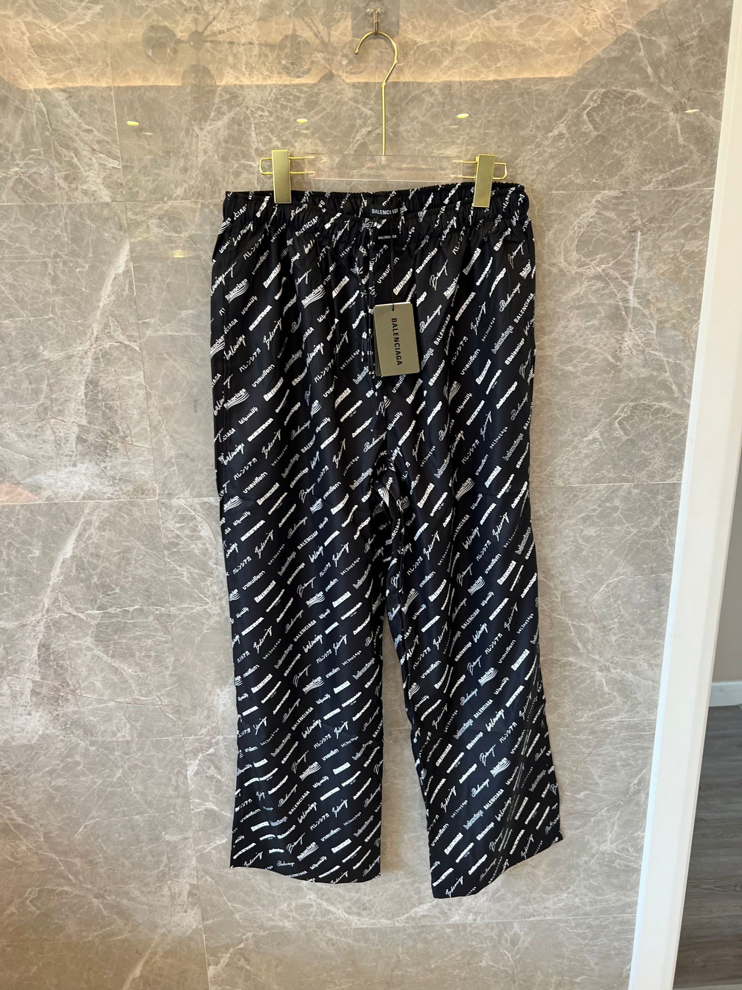 Balenciaga all-over logo track pants in black