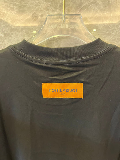 Louis Vuitton black t-shirt with "The Louis Vuittons" graphic and orange paris tag