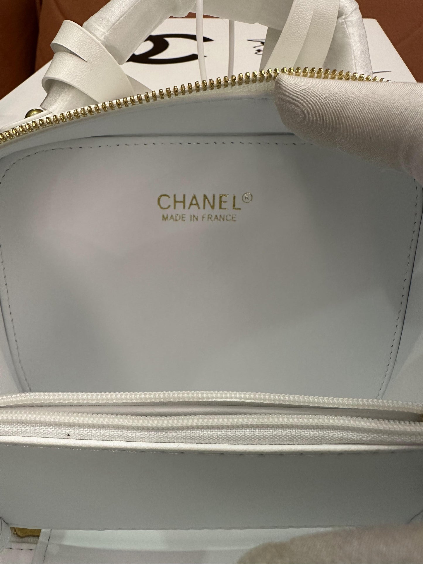 Chanel caviar quilted small CC filigree vanity case white