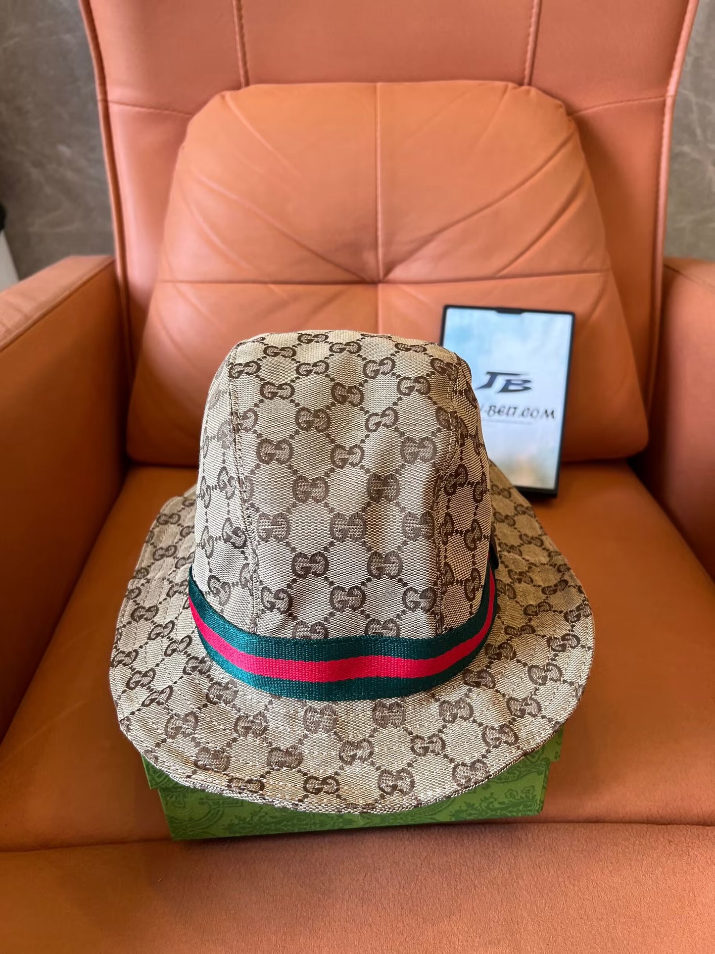 Gucci GG Supreme bucket hat with signature web stripe