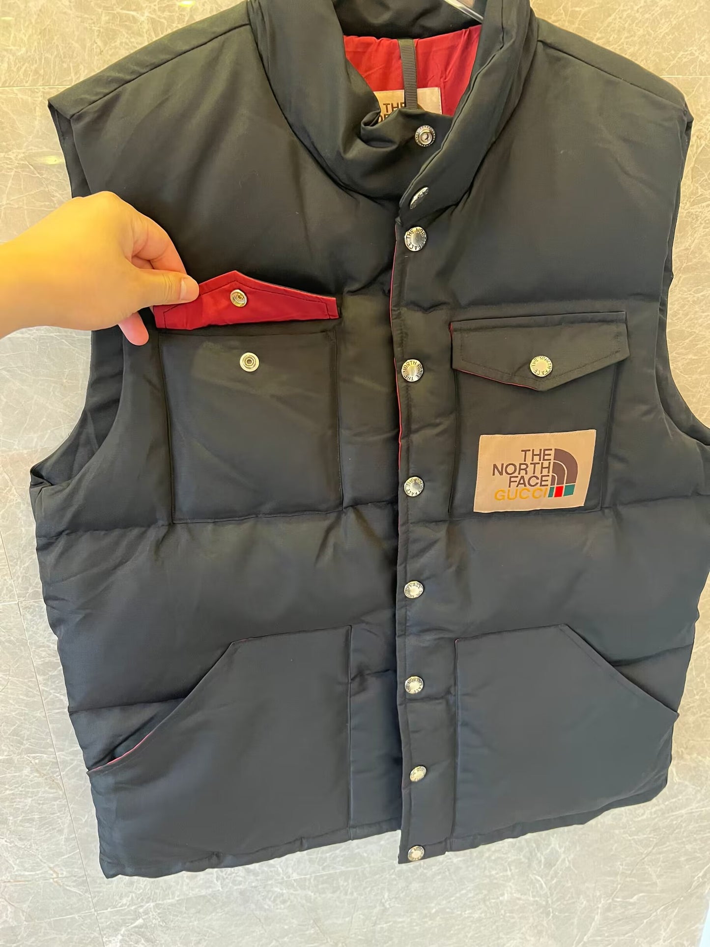 The North Face x Gucci black puffer vest