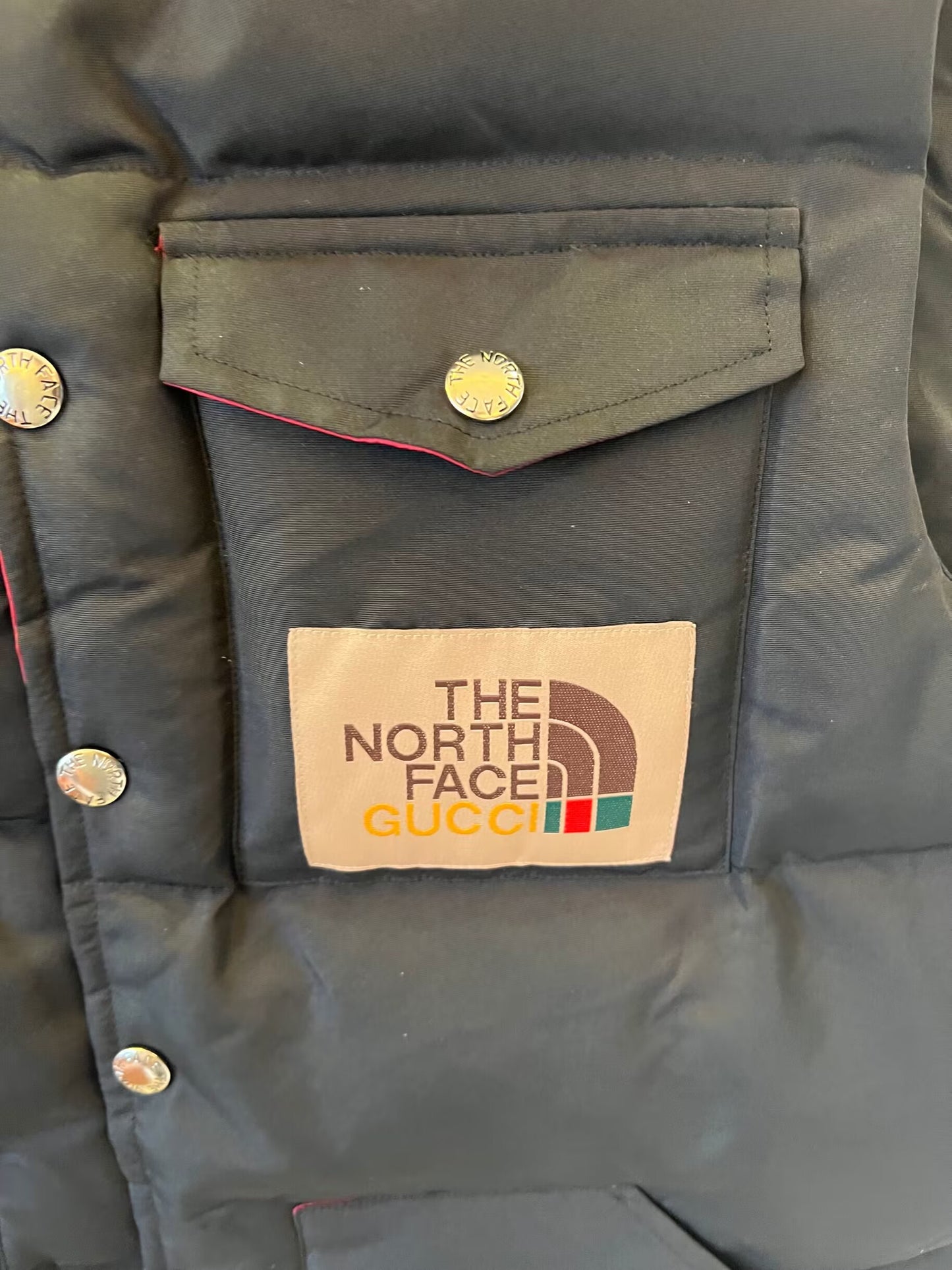 The North Face x Gucci black puffer vest