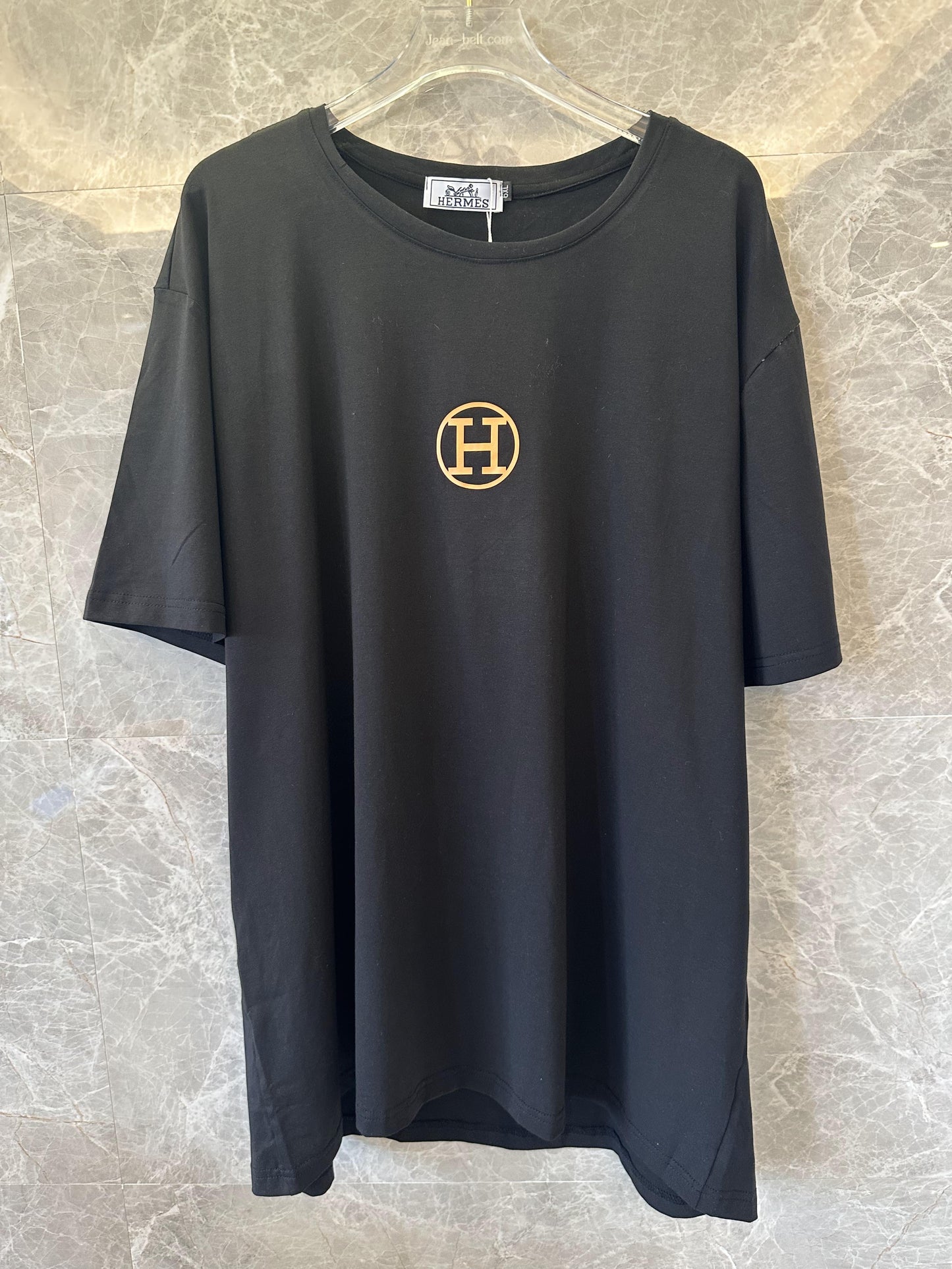 Hermès black t-shirt with gold logo and branding