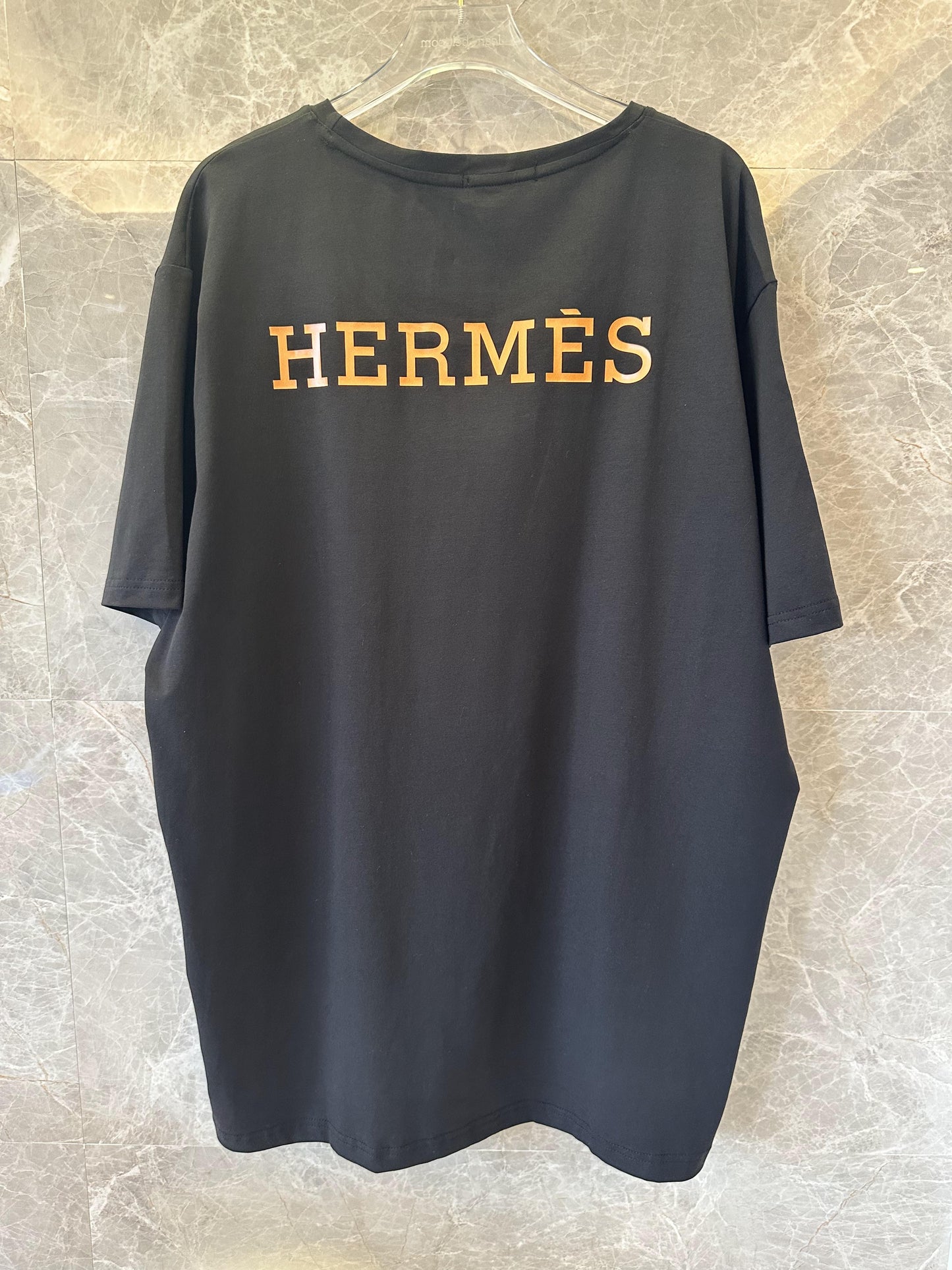 Hermès black t-shirt with gold logo and branding