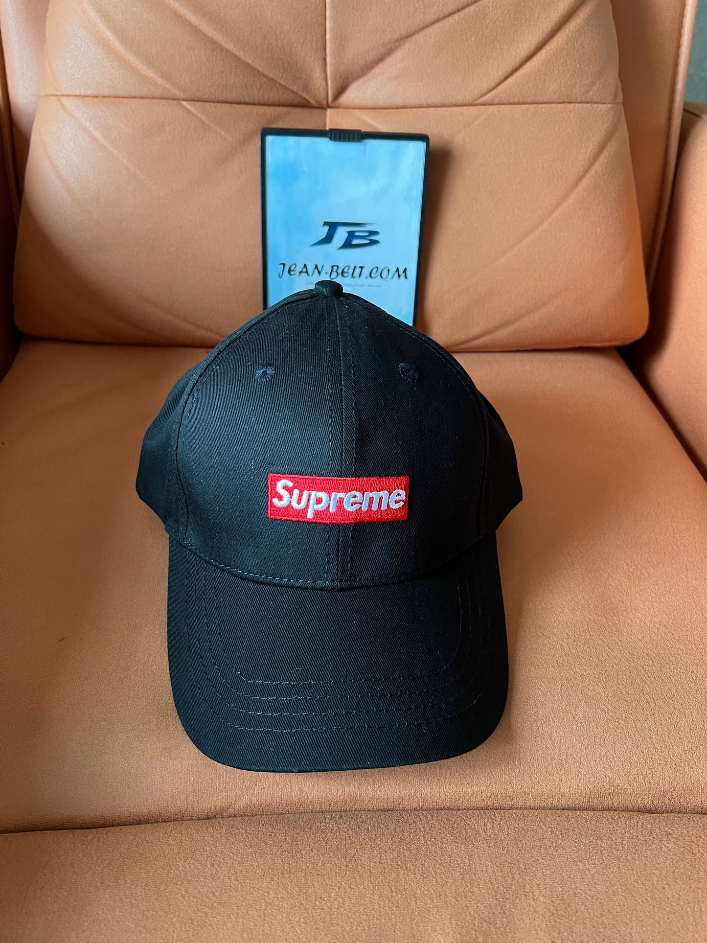 Supreme black baseball cap with iconic red box logo