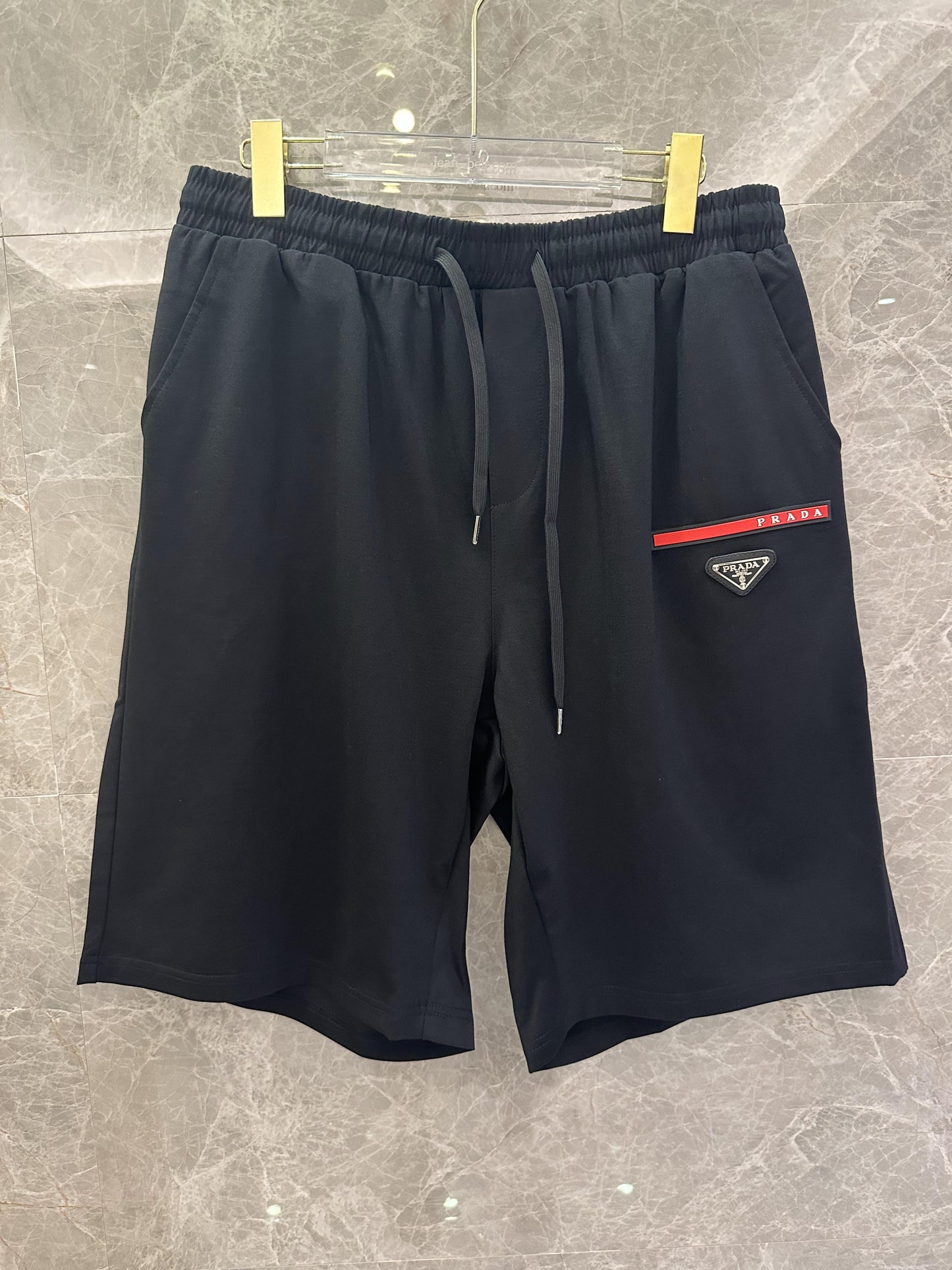 Prada black and white shorts with red stripe and logo patch