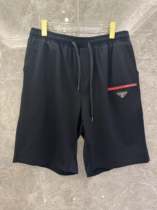 Prada black and white shorts with red stripe and logo patch