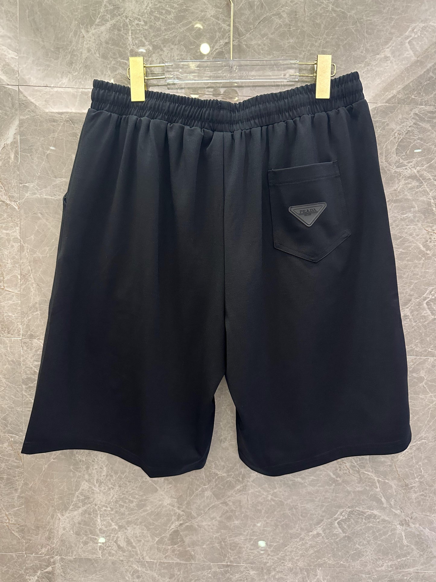 Prada black and white shorts with red stripe and logo patch