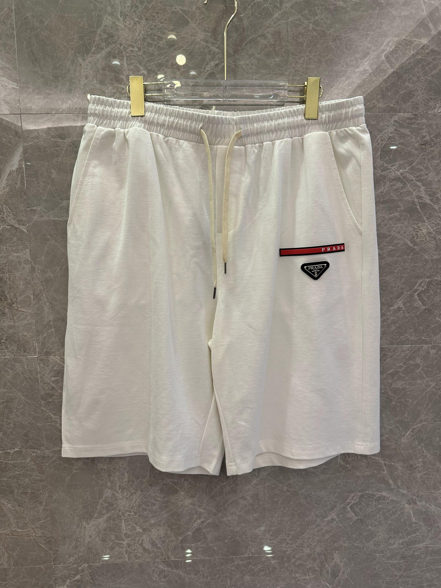 Prada black and white shorts with red stripe and logo patch