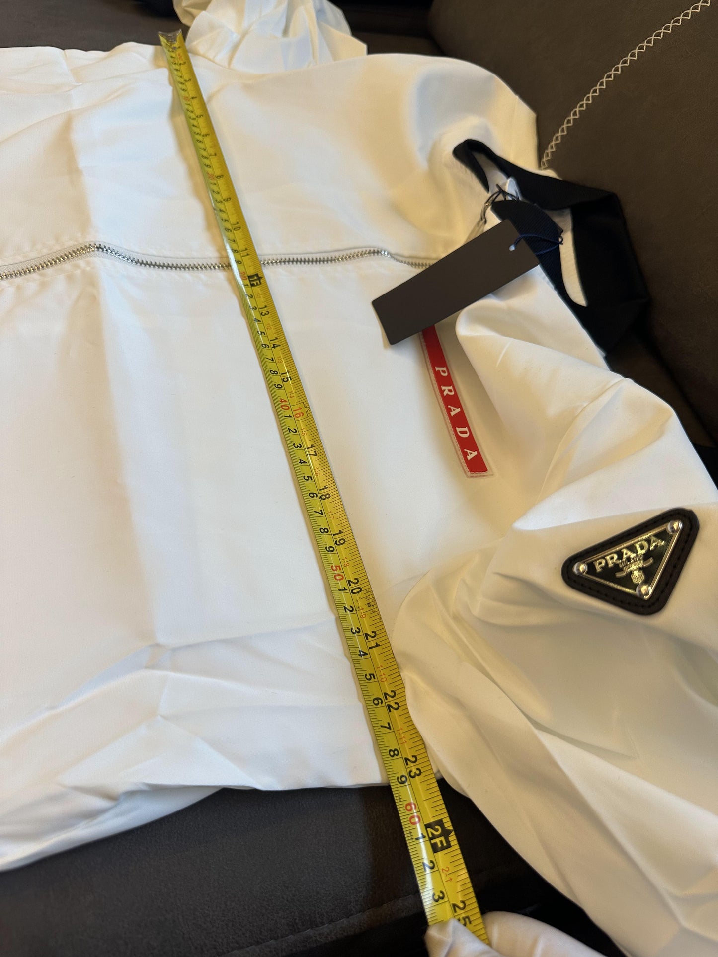 Prada white technical fabric bomber jacket with signature logo detailing