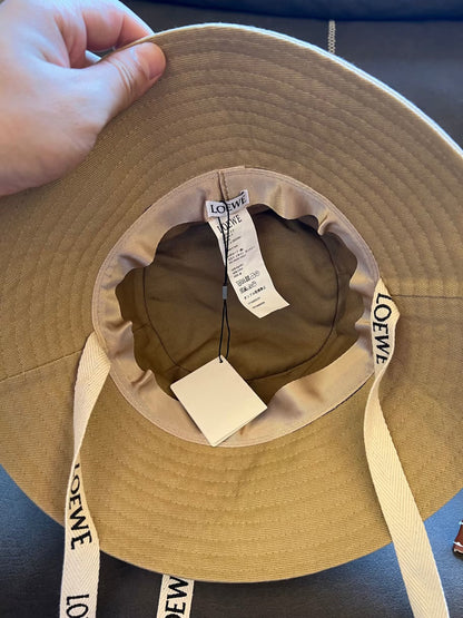 Loewe canvas bucket hat with leather logo patch and branded straps