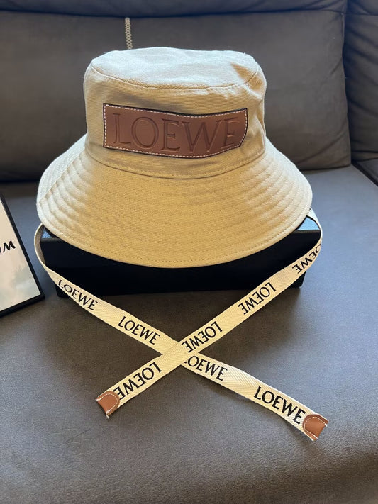 Loewe canvas bucket hat with leather logo patch and branded straps