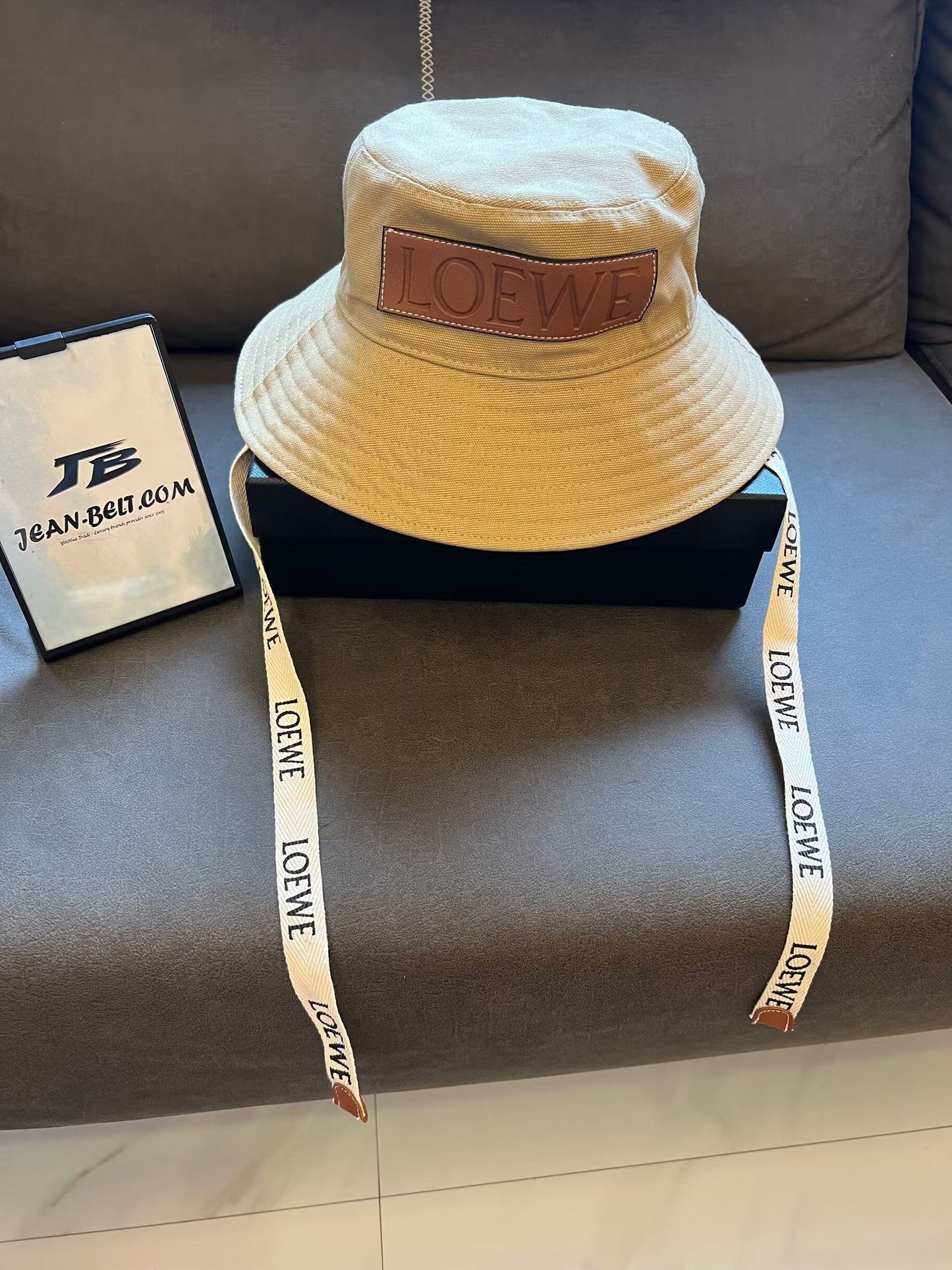 Loewe canvas bucket hat with leather logo patch and branded straps