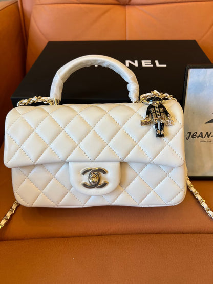 Chanel white quilted lambskin top handle mini flap bag