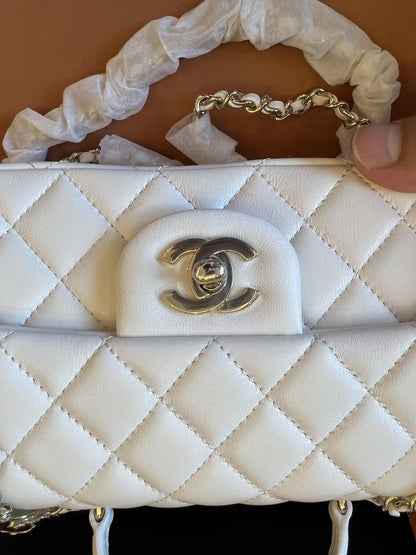 Chanel white quilted lambskin top handle mini flap bag